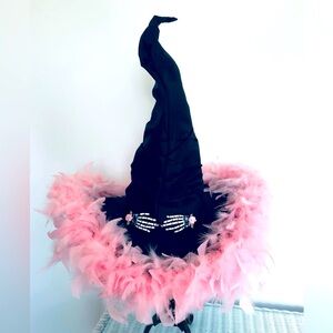Black, witchhat, pink feathered brim & Baby bone hands. 19" x 19"